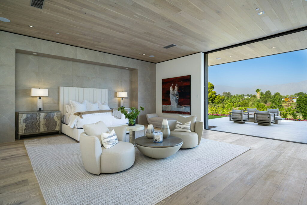 Grey area rug in a large luxury bedroom by Custom Carpet Centers in Orchard Park, NY - Williamsville, NY - Tonawanda, NY - Niagara Falls, NY - Olean, NY (Shop at Home) - Jamestown, NY.