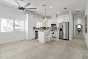The Durability of Tile flooring in the open style kitchen by Custom Carpets Center in Western NY